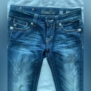 Miss Me. Embellished rhinestone studded floral pocket boot-cut denim jeans.